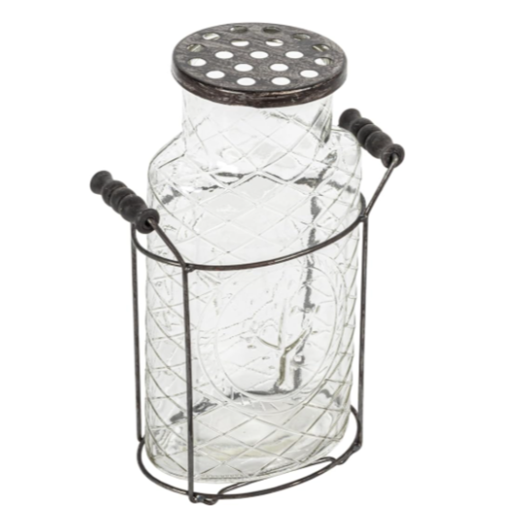 A clear glass vase with a metal stand and metal frog lid, designed for floral arrangements.
